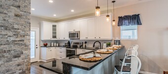 Experience the Captain's Quarters.  A Historic 1920 American Four Square.