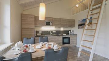 Fridge, stovetop, dishwasher, coffee/tea maker