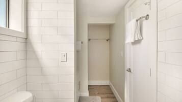 Shower, eco-friendly toiletries, hair dryer, towels