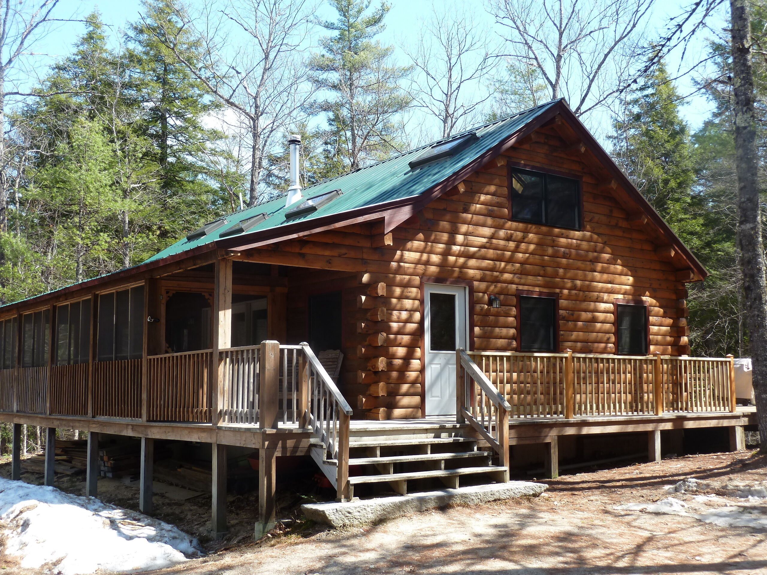 Log Cabin on Spacious Lakeside Woodlands, with Private Beach and Waterfront. 