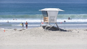 A lifeguard tower with the number 10 on it, located on a sandy beach with the ocean in the background. - Oceanfront South Mission Beach Vacation Rental on the Sand 2737 (San Diego)