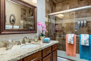 Bathtub, hair dryer, towels, soap