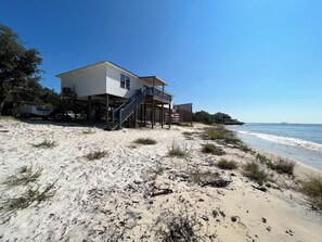 On the beach, sun-loungers