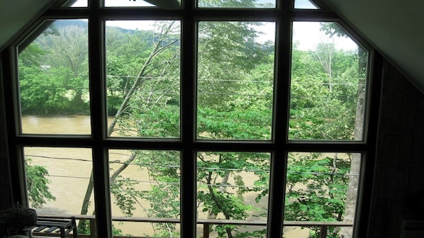 Enjoy a serene river view from the large octagonal window.
