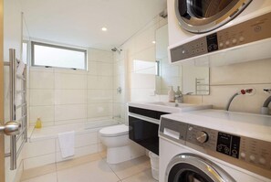 Bathtub, hair dryer, towels