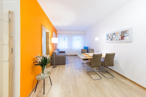Enjoy meals with family and friends in this cozy dining area, complete with a table for four and comfortable seating.