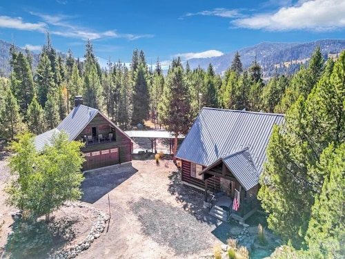 River front cabin surrounded by national forest with outdoor living space 