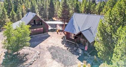 River front cabin surrounded by national forest with outdoor living space