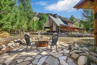 River front cabin surrounded by national forest with outdoor living space 