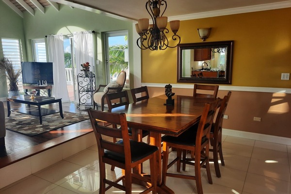 Dining room and living room area opens up to an expansive patio w/amazing views