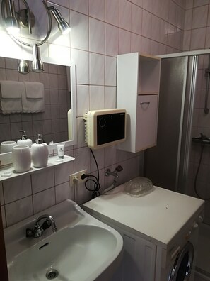 Hair dryer, towels, soap, shampoo