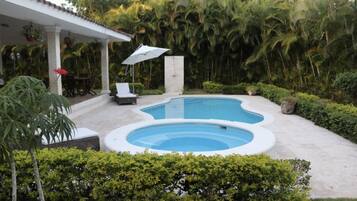 Outdoor pool, pool umbrellas, sun loungers