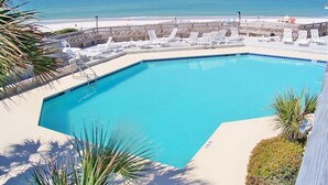 A pool area with a view of the beach and ocean. - Direct Beachfront, gorgeous sunsets, gated community, north Cape near state park (Port St. Joe)