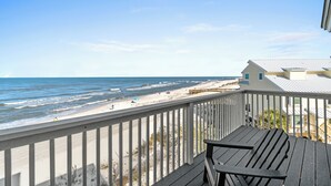 A wooden deck with a view of the beach and ocean. - Direct Beachfront, gorgeous sunsets, gated community, north Cape near state park (Port St. Joe)