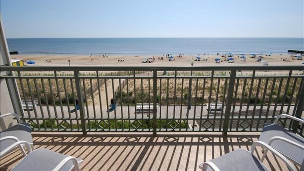 A balcony with a view of a beach. - Edgewater House - Ocean Front Units With Spectacular Views! (Rehoboth Beach)