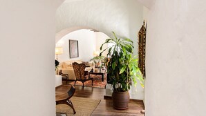 An interior with a living room, a dining area, and a large potted plant. - Rustic Home Short Drive from Beach with Pool, Terraces & Garden (Güime)