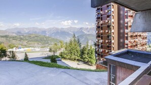 A modern building with a view of mountains. - Soyouz Vanguard by Interhome (Le Corbier)