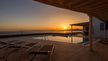 An infinity pool, sun loungers