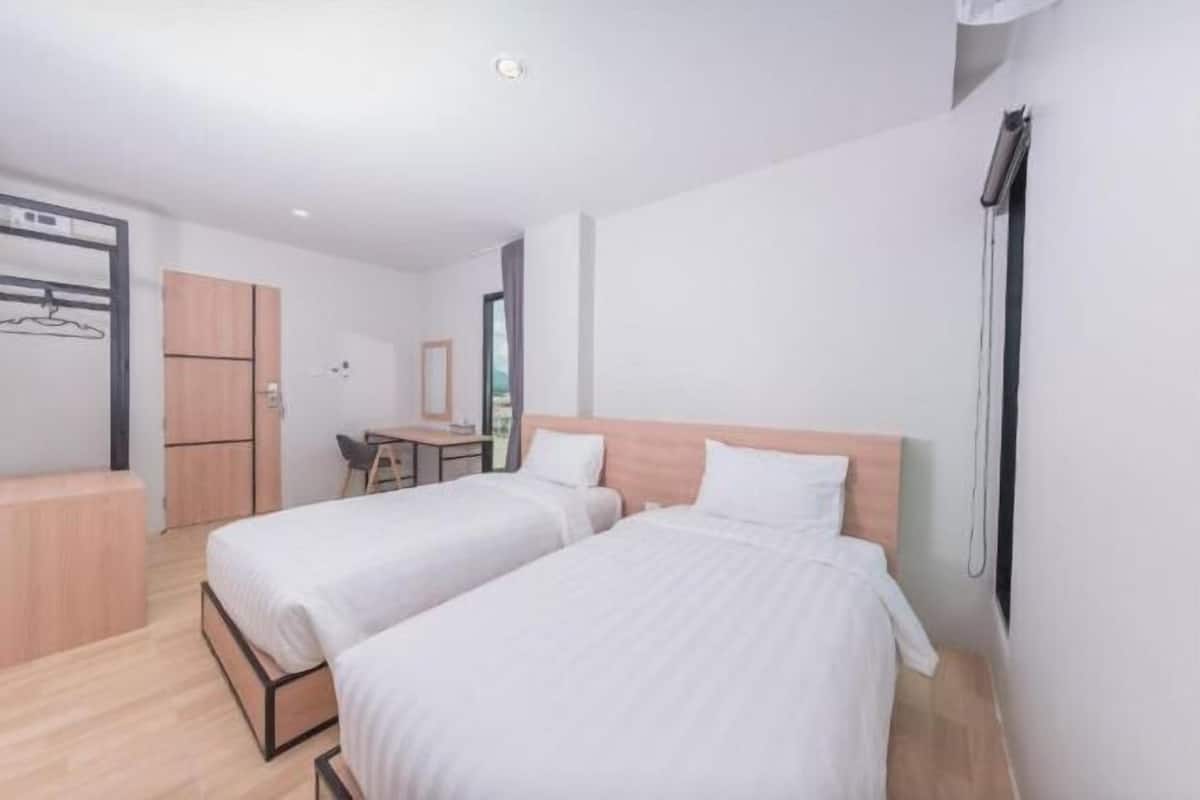 Desk, laptop workspace, free WiFi, bed sheets