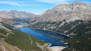 A mountainous landscape with a lake and a dam. - San Anton by Interhome (Bormio)