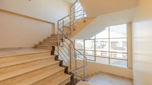 A staircase with metal railings leading to a landing. - Hotel Lords Mumbai (Mumbai)