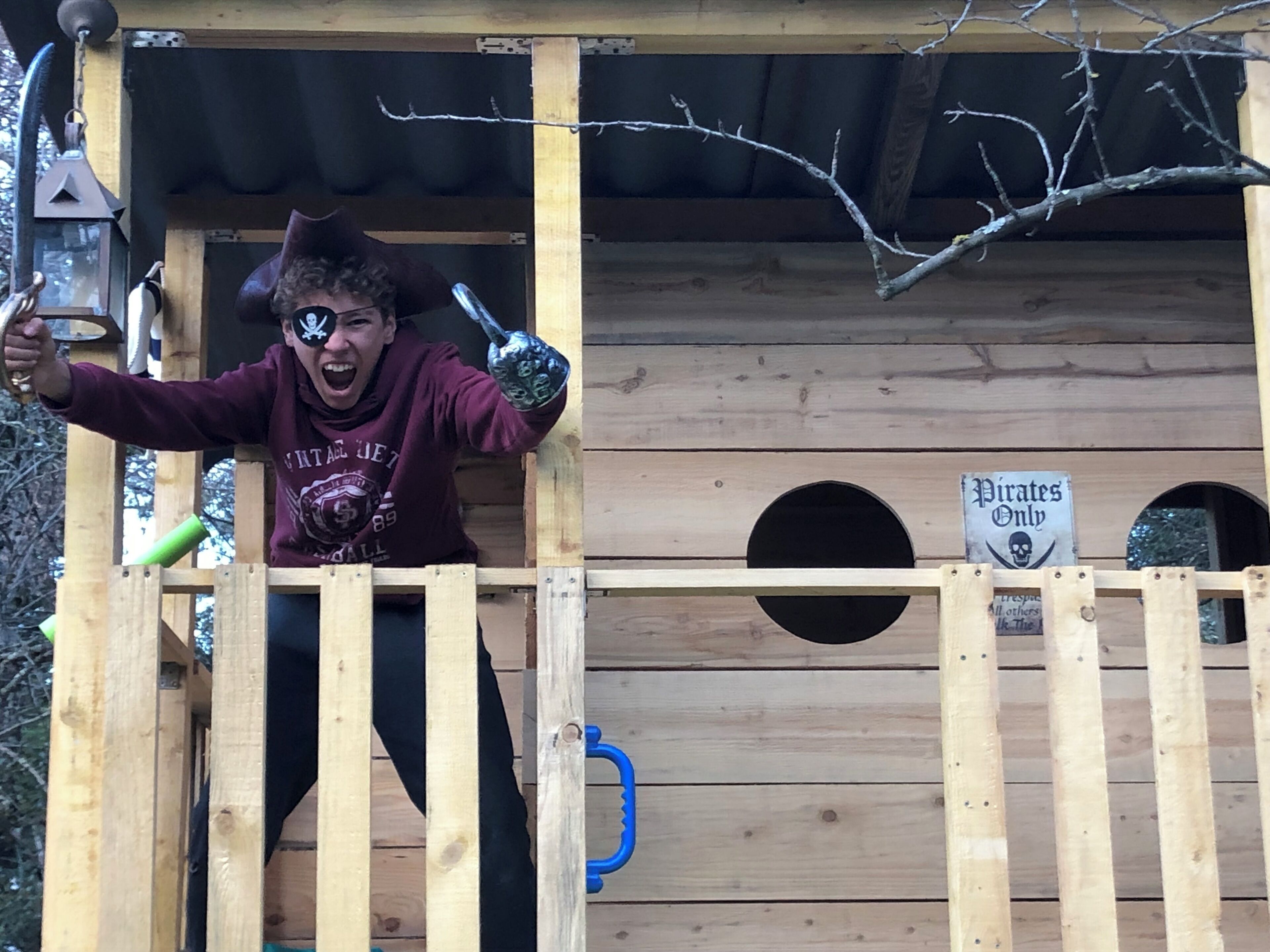 A wooden pirate-themed structure with a sign reading "Pirates Only" and a skull symbol.