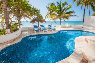 Perfect for a large group! Beachfront 7 bedroom villa with pool, AC and WiFi!