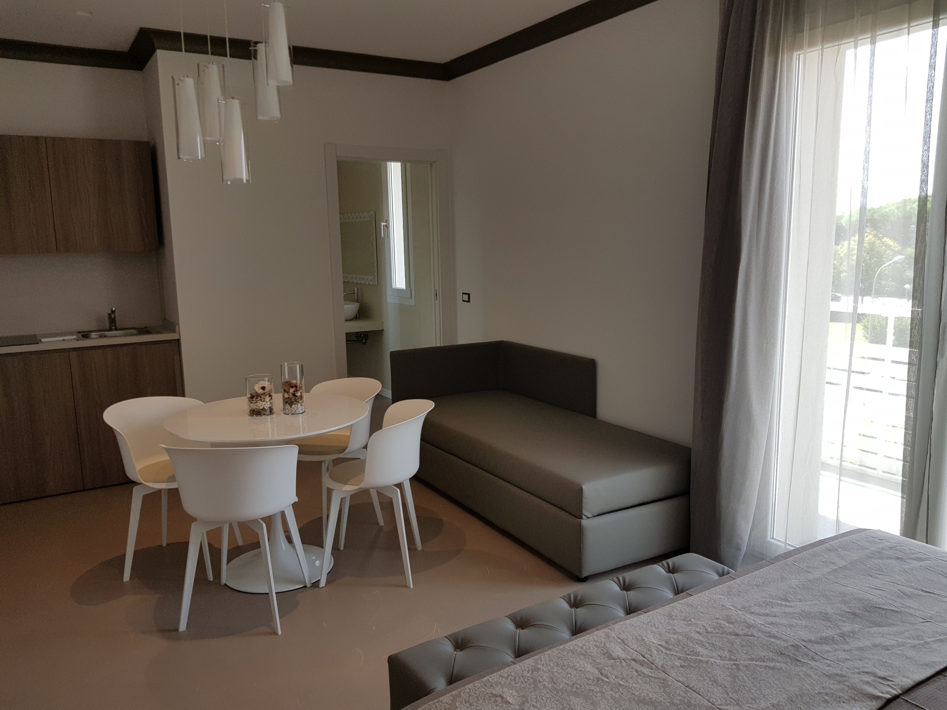 Junior Suite, Kitchenette | Living room | Flat-screen TV