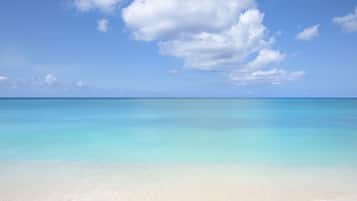 On the beach, sun loungers, beach towels