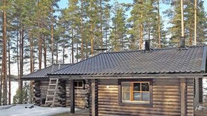 A log cabin with a sloped roof, a window, and a chimney. - Näätämö by Interhome (Asikkala)