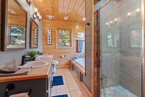 Combined shower/bathtub, jetted bath, towels, soap