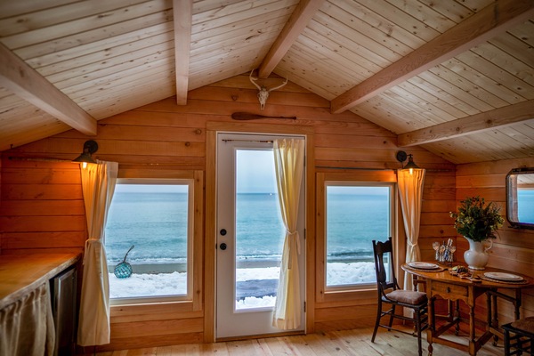 Several vintage portholes were used to build this cabin, enjoy this unique space