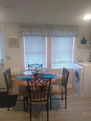 Enjoy meals in this cozy dining area with a round table and four chairs.