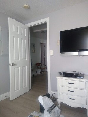 Enjoy a comfortable stay with a flat-screen TV and convenient storage in this well-appointed room.