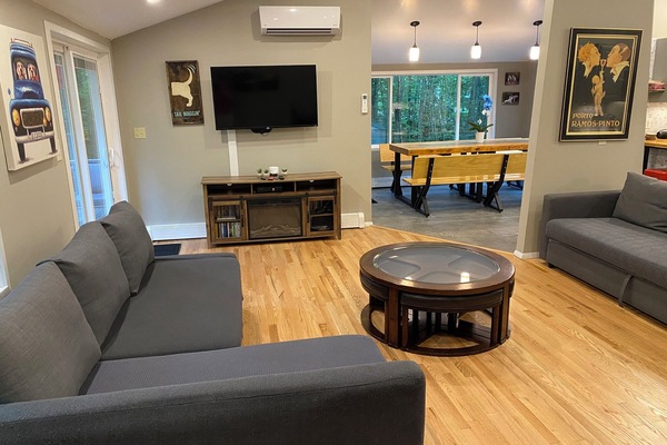 upper floor open concept living room with kitchen and dining area