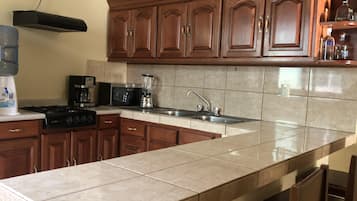 Microwave, coffee/tea maker, cookware/dishes/utensils