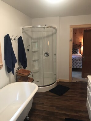 Bathtub, towels, soap, toilet paper