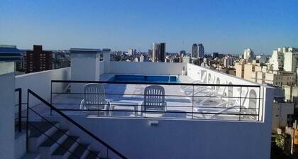 Stylish San Telmo apartment w/pool, gym & balcony—steps from iconic market!