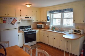 Fridge, microwave, oven, stovetop - Charming Ranch Home with Sunroom & Fenced Yard – Perfect Cape Escape! (Dennis Port)