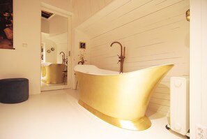 Bathtub, hair dryer, towels, soap