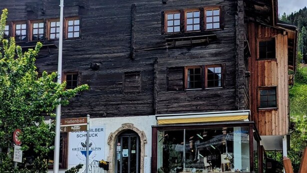 A rustic wooden building with a stone staircase leading to the entrance. - ABC Ferienwohnung 1 1. OG Süd by Interhome (Fiesch)