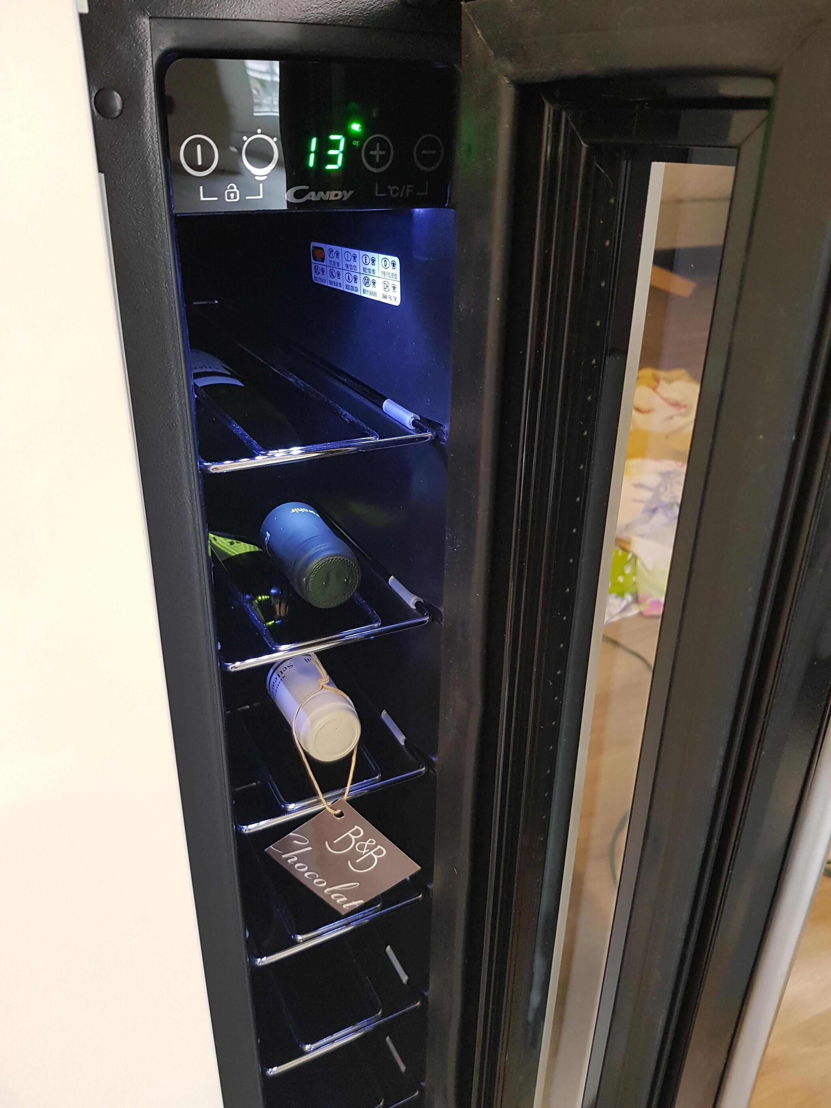 A vending machine with a digital display showing the number 13.