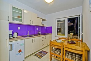 Fridge, coffee/tea maker, toaster, cookware/dishes/utensils