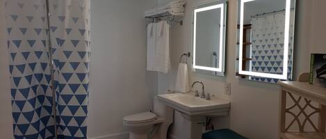 Combined shower/tub, hair dryer, towels, soap