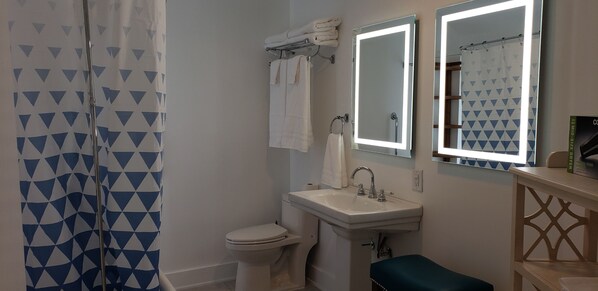 Combined shower/tub, hair dryer, towels, soap