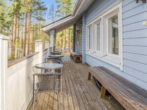 Enjoy outdoor dining or relaxation on the deck with comfortable seating and scenic views.