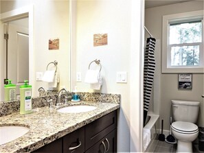 Combined shower/tub, hair dryer, towels, soap