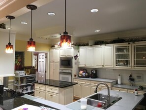 Microwave, dishwasher, coffee/tea maker, cookware/dishes/utensils