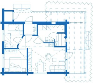 A floor plan with multiple rooms, including a kitchen, dining area, and living spaces.