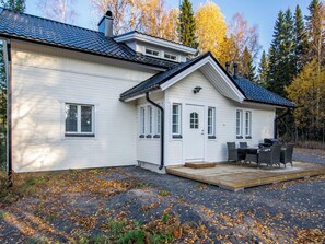 A two-story house with a covered patio and a deck. - Hovimäki by Interhome (Jämsä)